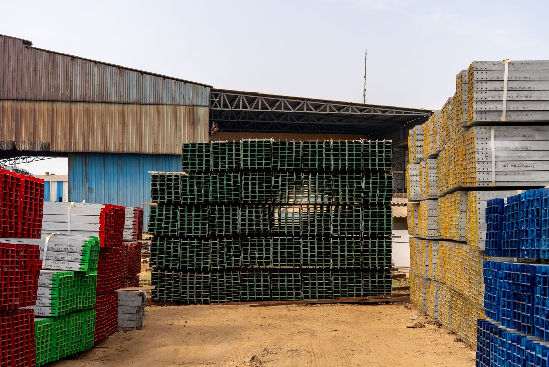 Wide aisles in a building supplies distribution hub where autonomous scrubbing can run after shifts.