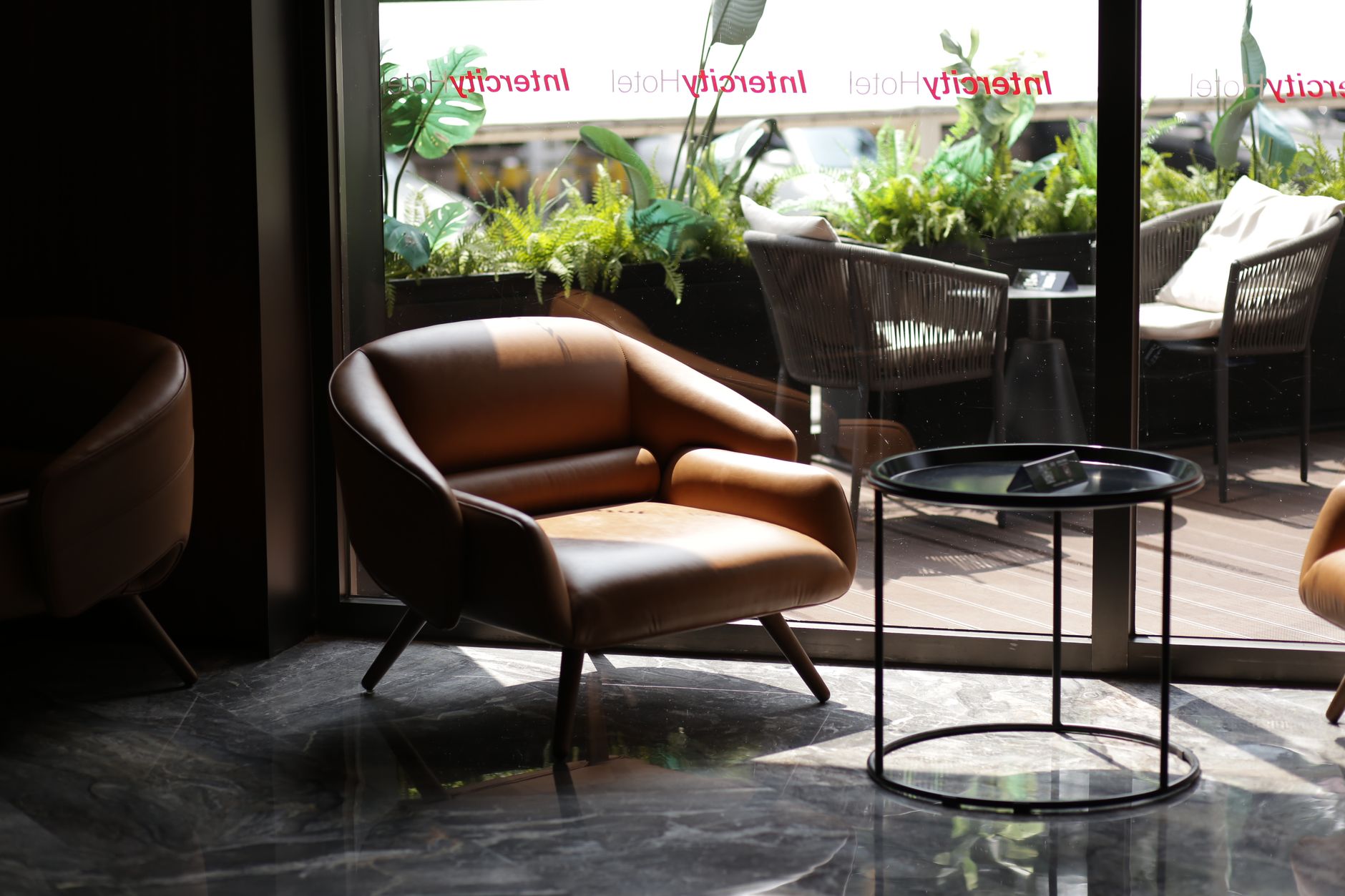 Hotel lobby seating area that benefits when staff regain time from automated corridor cleaning.