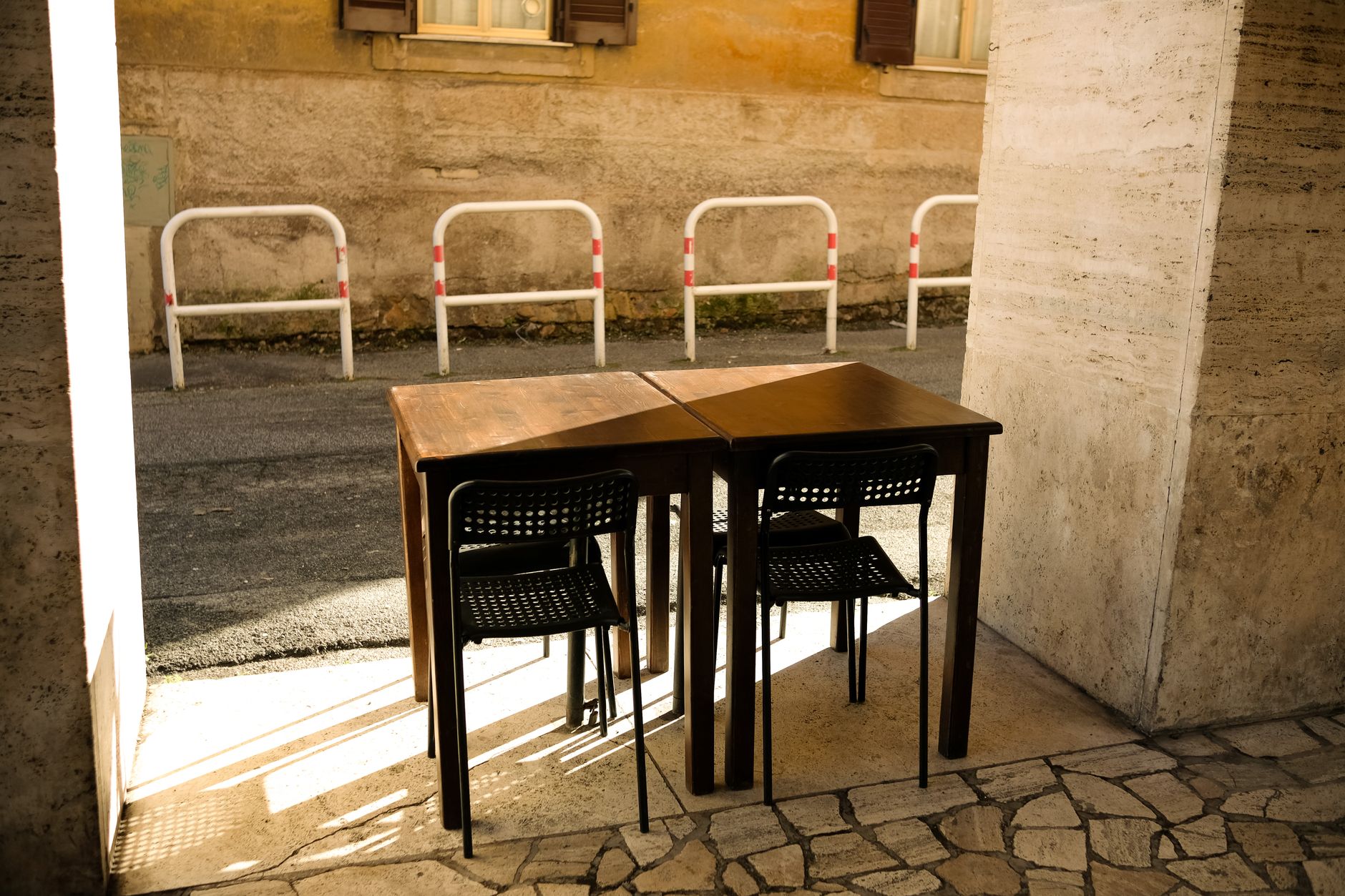 Recently cleared cafe tables with chairs reset, showing the pace of turnover during peak dining hours.