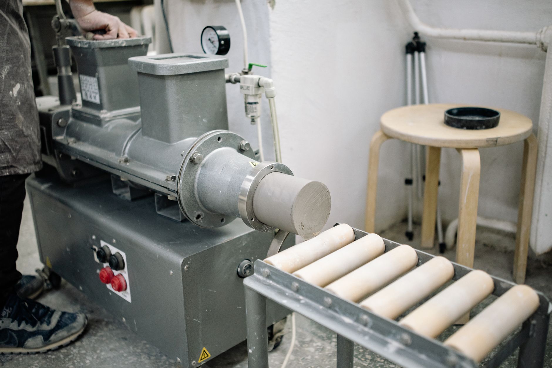 A clean, expansive manufacturing floor inside an advanced-ceramics production facility.