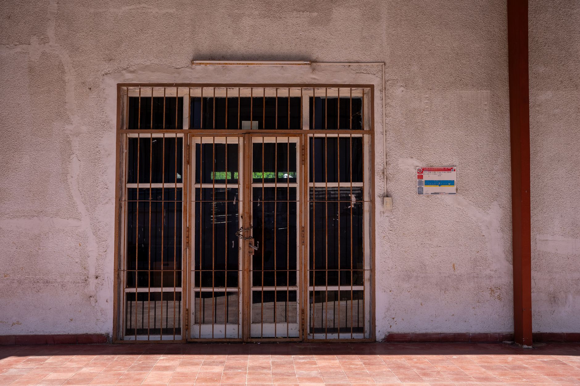 Families enter a hospital campus where infection prevention teams track ward-level outcomes.