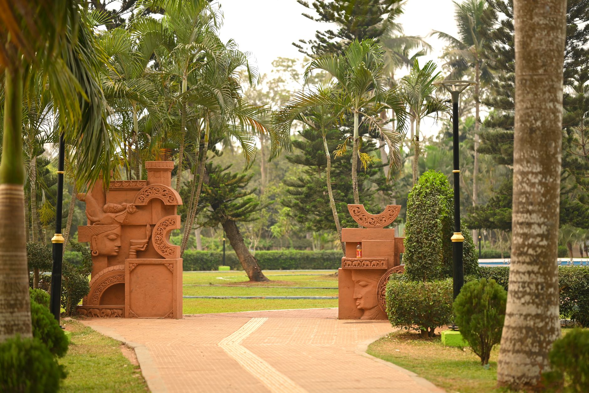 A main park walkway near an entrance, showing the kind of open outdoor area where visible patrol presence helps deter incidents.