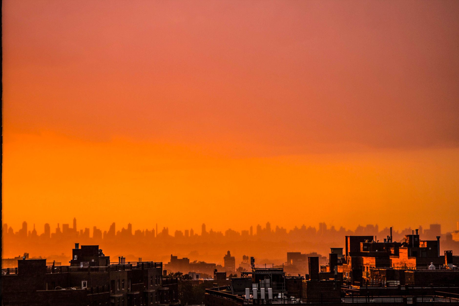 A city skyline where rooftop dock placement enables fast aerial response to emergency calls.