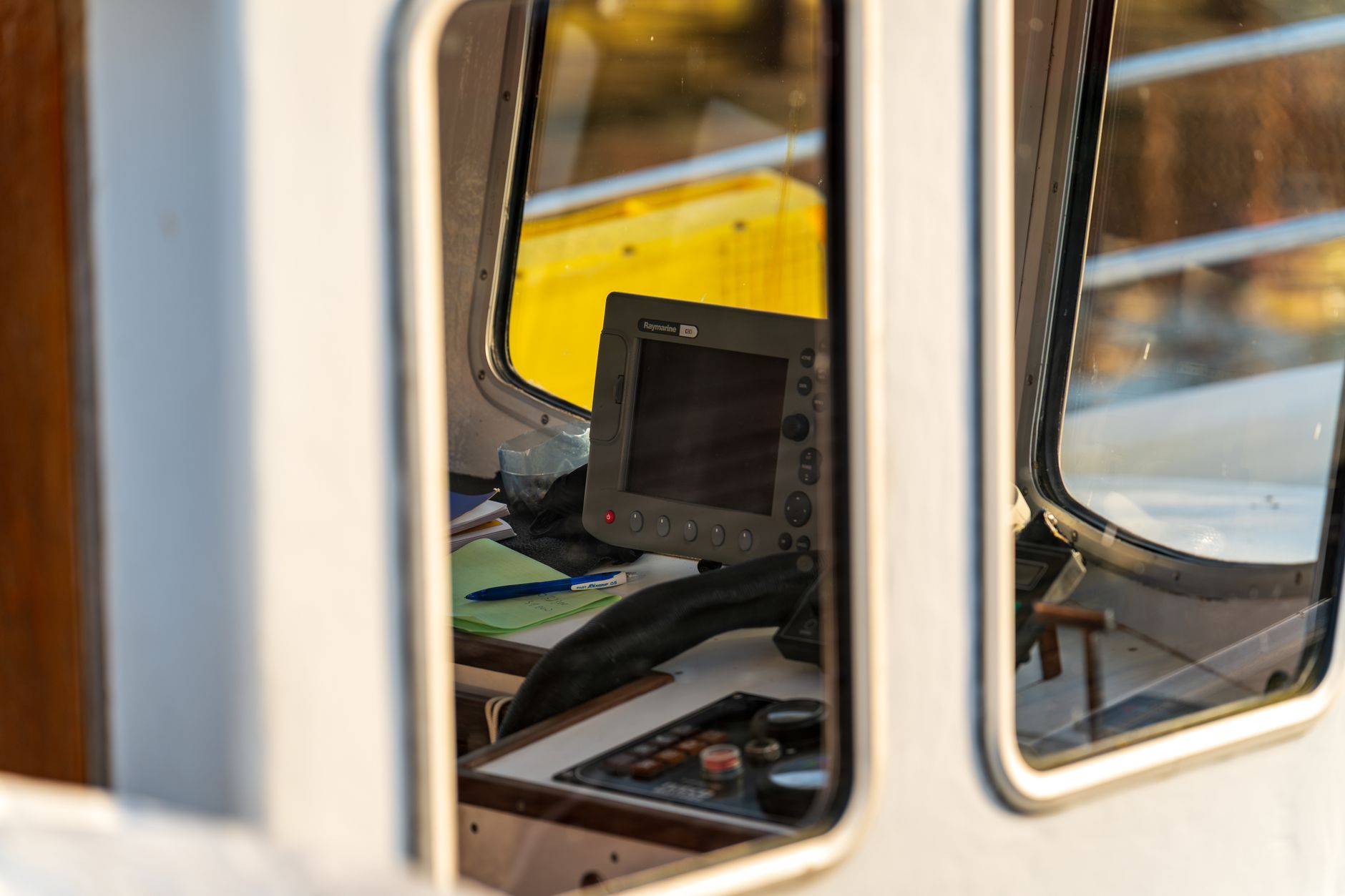 Port operations staff monitor vessel and terminal activity from a control room.