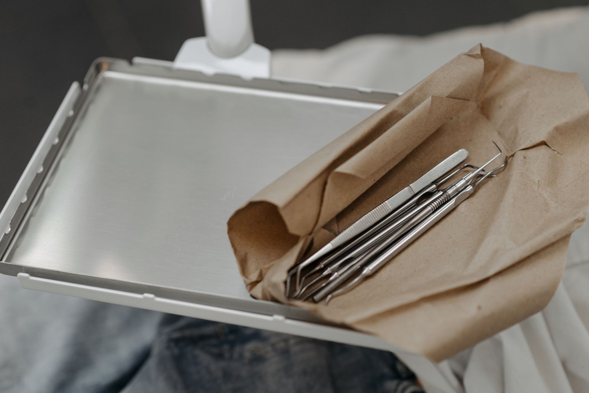 A prepared tray of dental instruments ready to be moved into a treatment room.