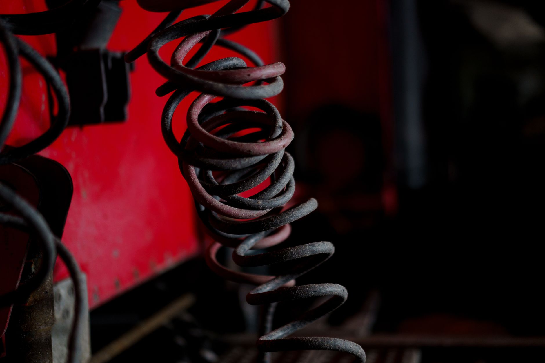Close-up of precision metal springs arranged for inspection in a manufacturing setting.