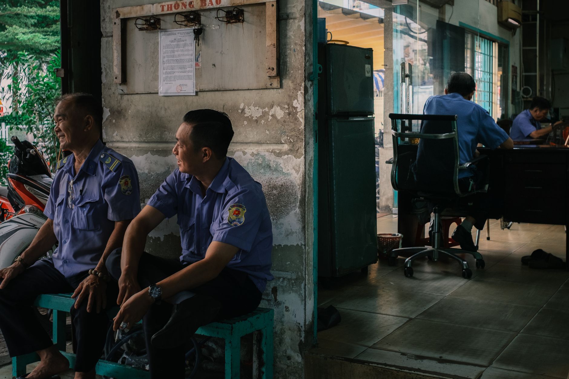 A building lobby security desk where staff receive alerts from garage patrol systems.