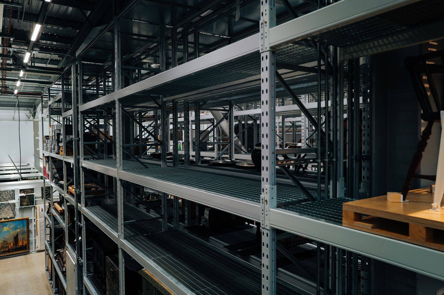 Dense double-deep storage racks fill a compact distribution building.