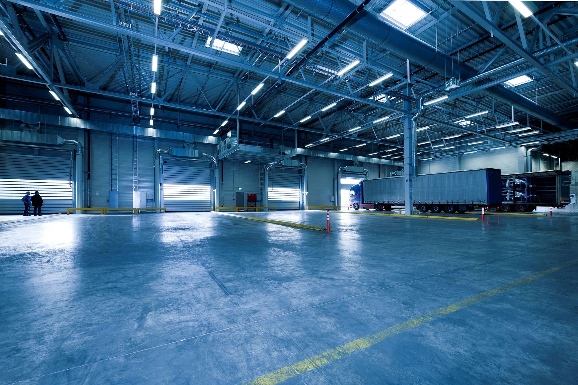 A logistics hub aisle where an autonomous scrubber can run between shifts.