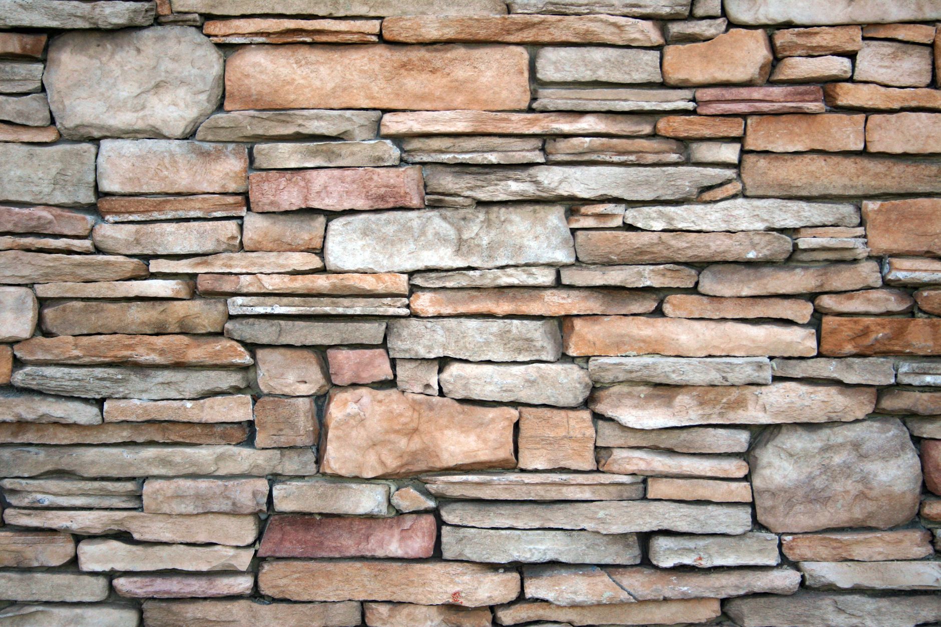 Finished faux-stone veneer panels stacked for shipment from a building-products plant.