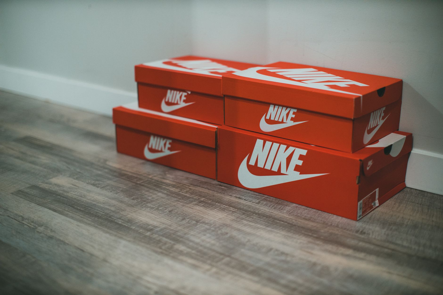 Stacks of shoe cartons on pallets, illustrating high-SKU footwear inventory in a 3PL building.