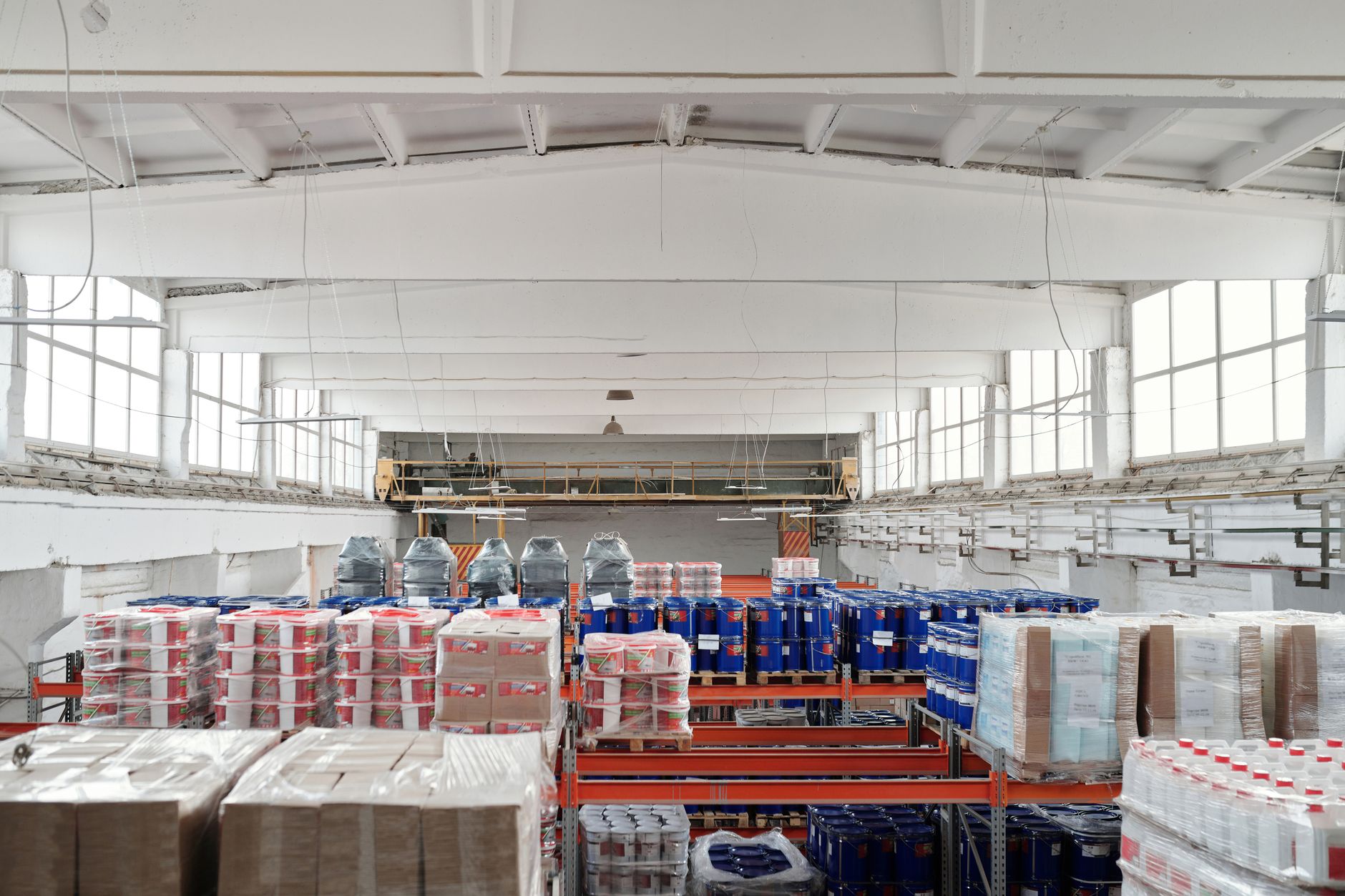 Warehouse employees gather for a safety briefing before beginning distribution-center work.