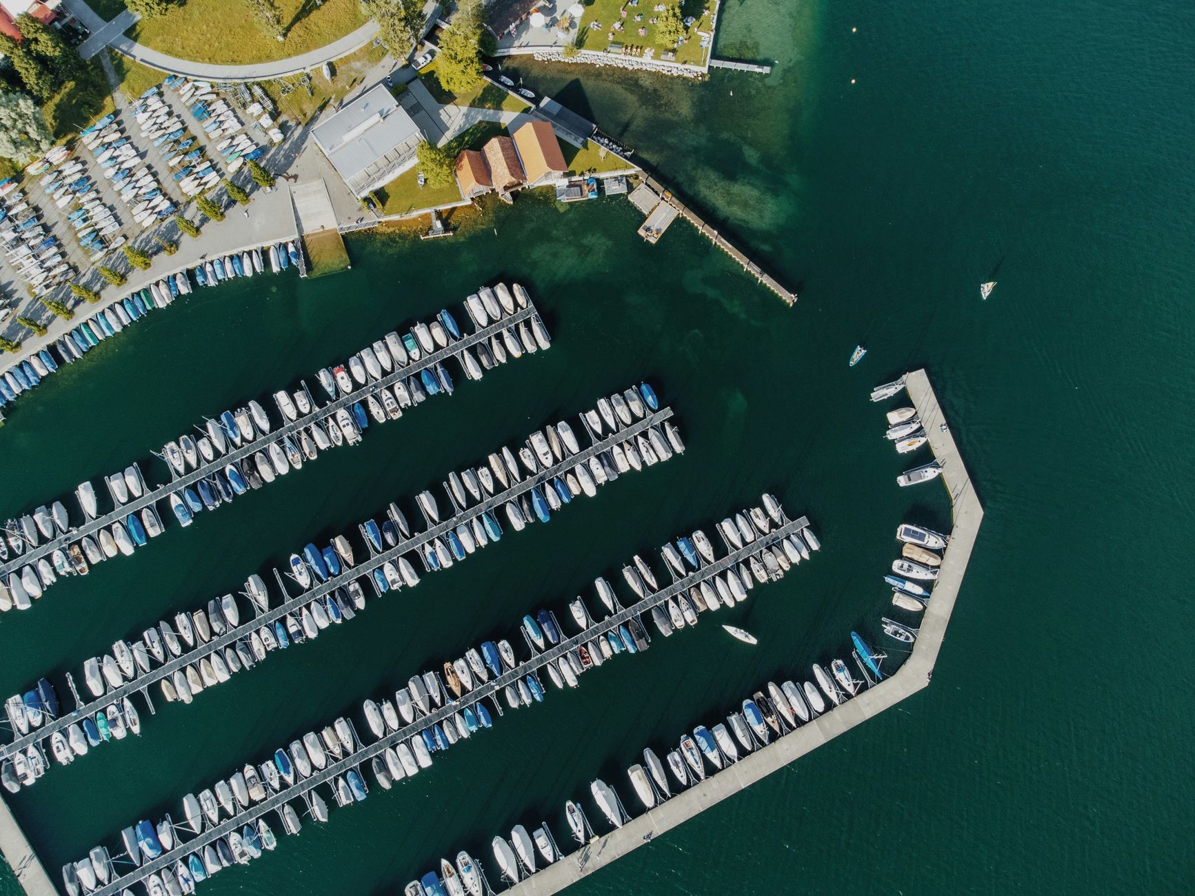 Rows of recreational boats and docks show the working harbor environment where continuous debris collection was introduced.