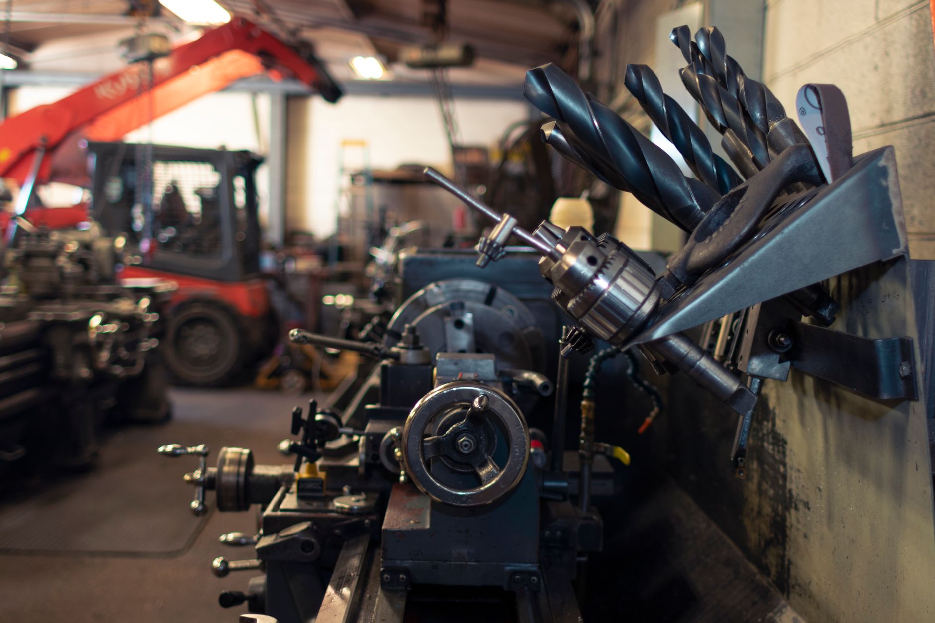 A heavy-machining shop floor with large metalworking equipment and workpieces.