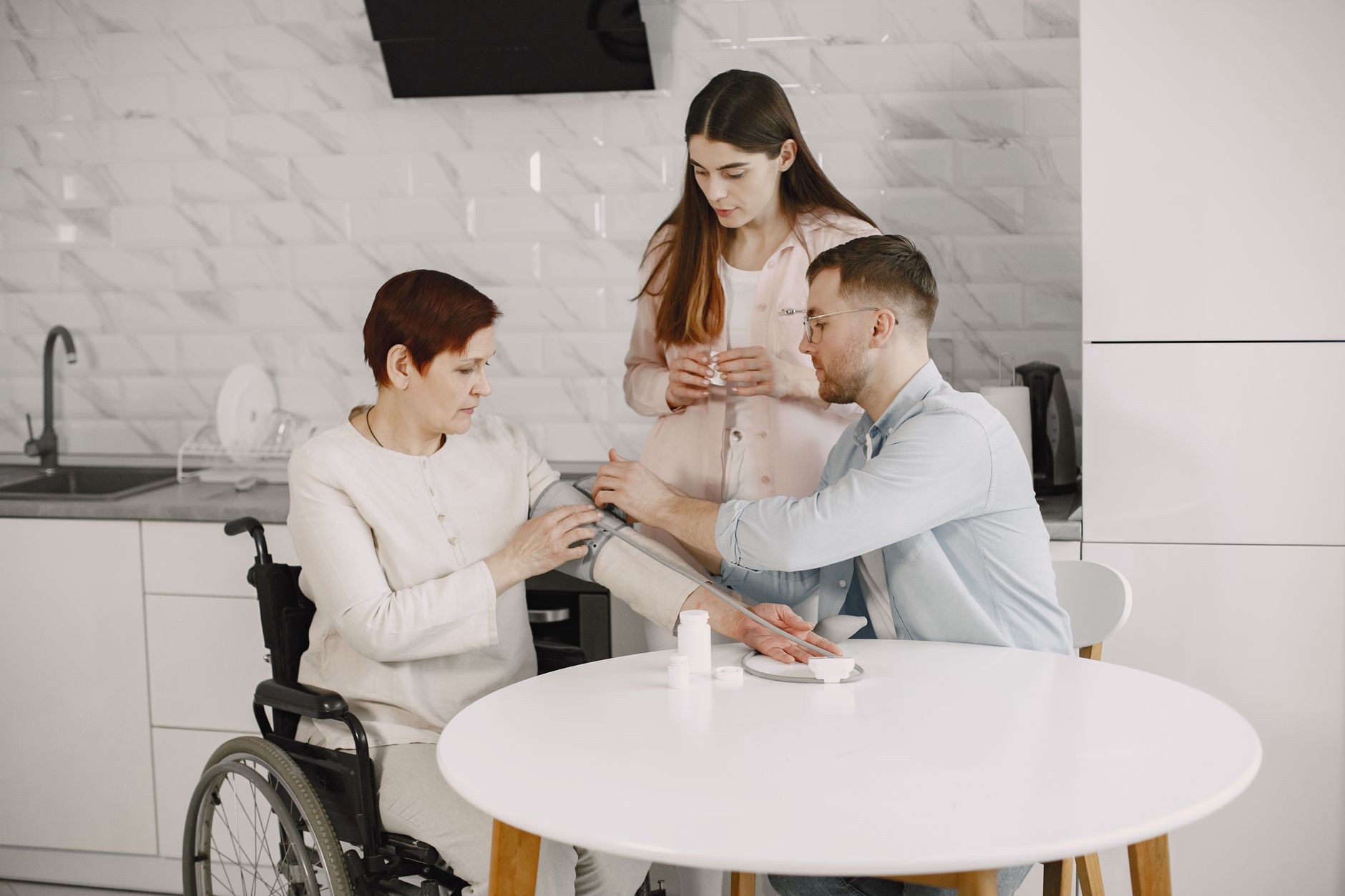 A home-care professional speaks with an older adult during a visit in the client’s home.