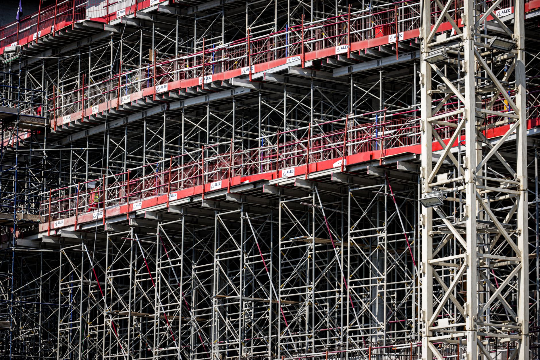 Scaffolding and structural work on a tower under construction, matching the setting for a field trial on live hotel columns.