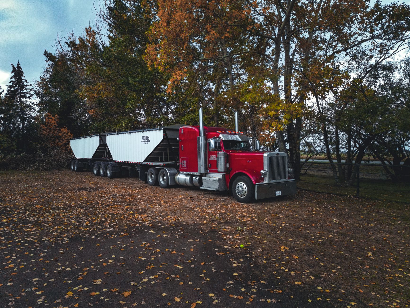 A landscaping service trailer parked for a commercial route, echoing how slope crews deploy to multiple properties.