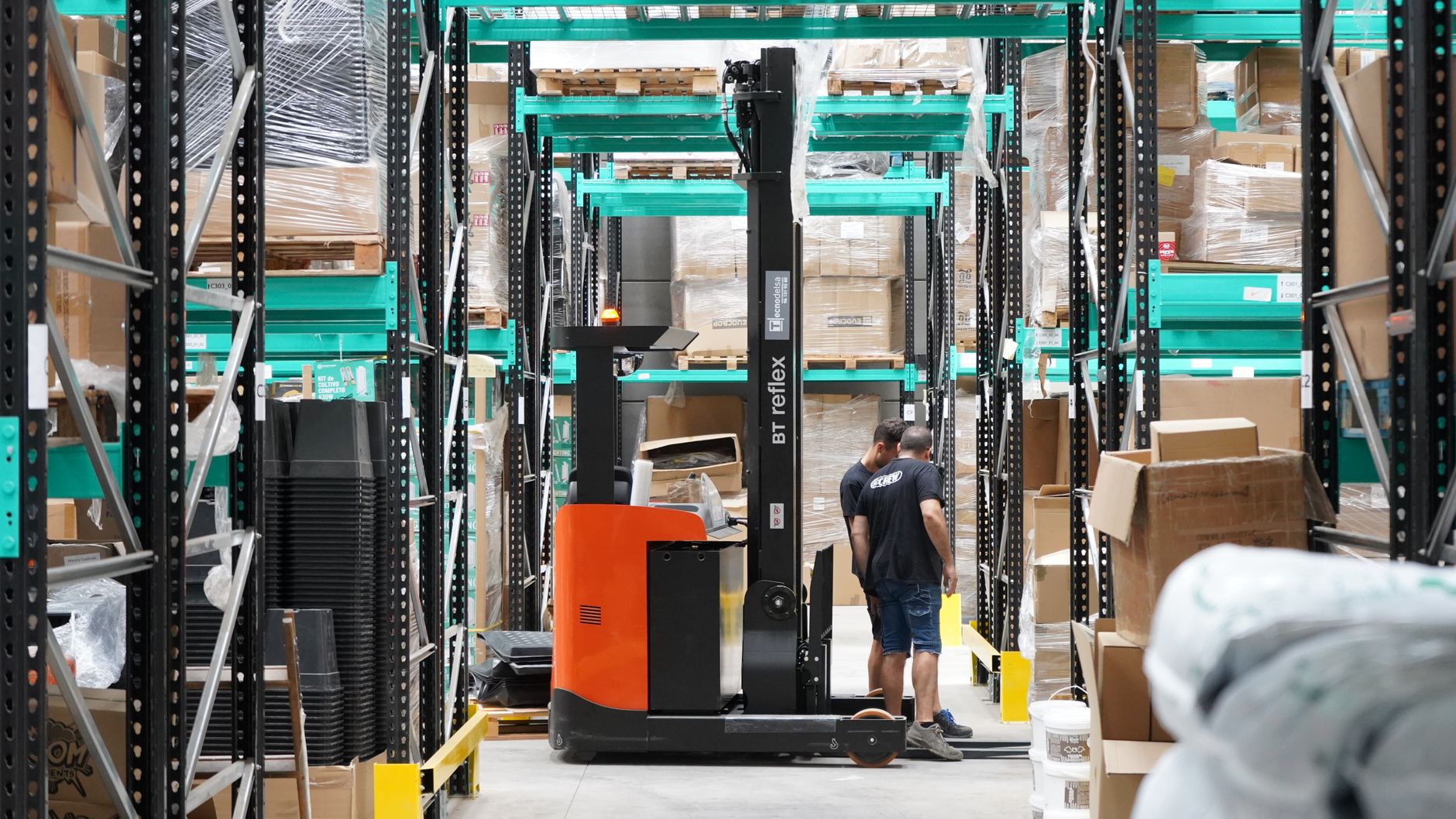 Operations staff review screens in a distribution center.