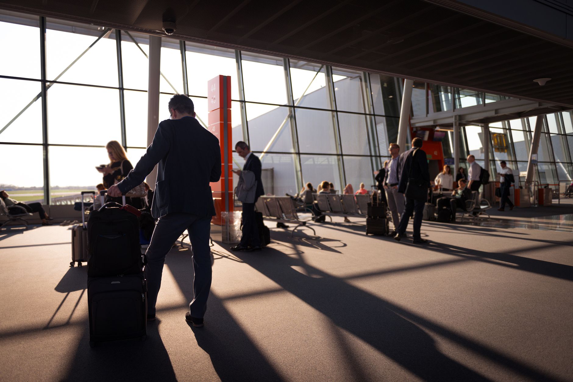 A busy airport terminal where autonomous scrubbers run on off-peak schedules.
