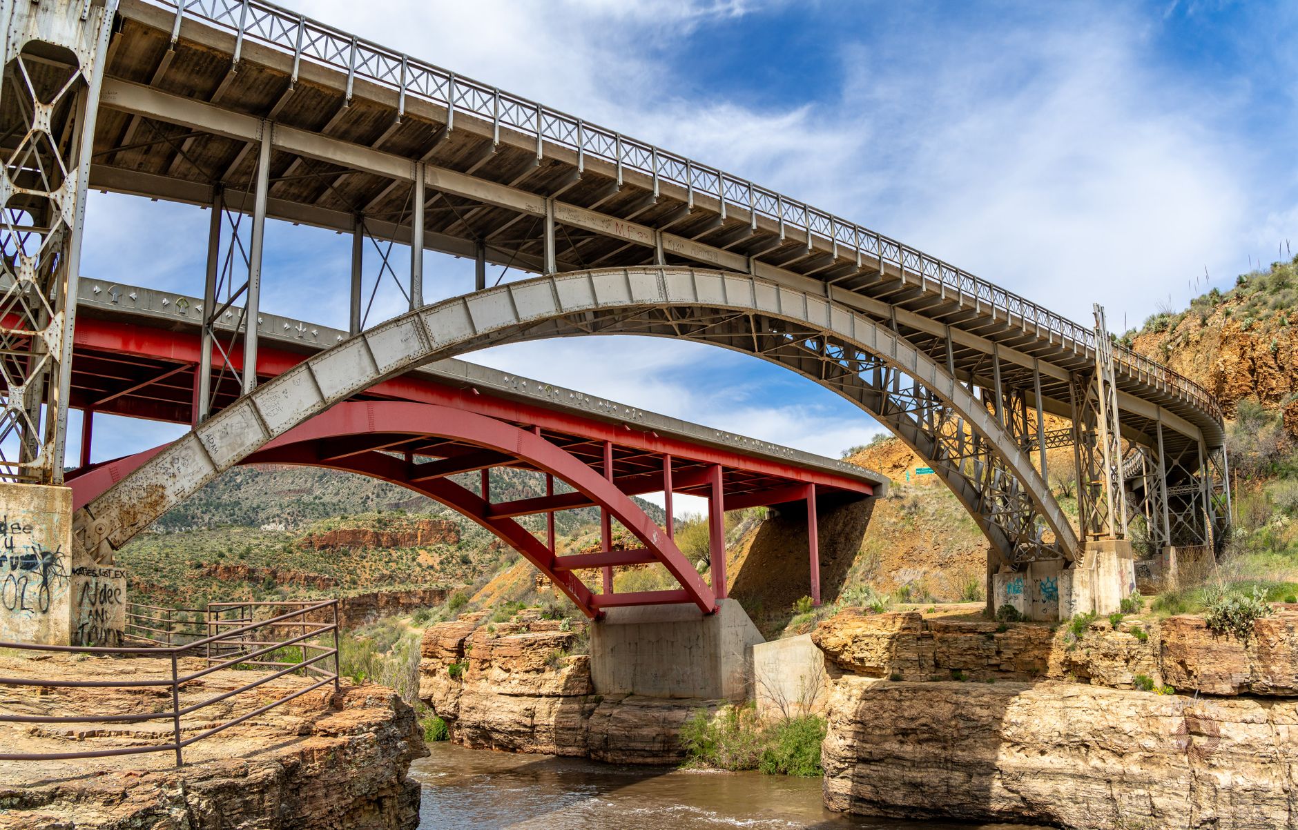 A long highway bridge crossing a deep river gorge, echoing the kind of interstate span that needs careful structural inspection.