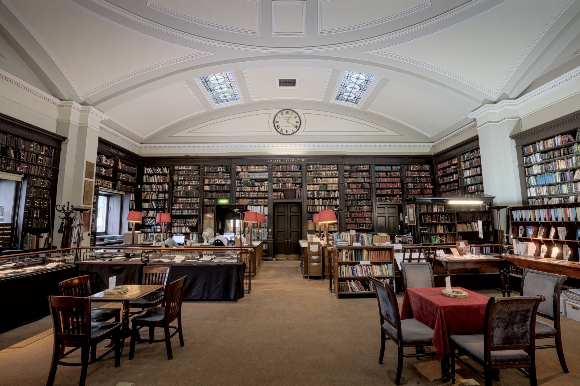 A public library reading room with hard floors that must be clean and dry before visitors arrive.