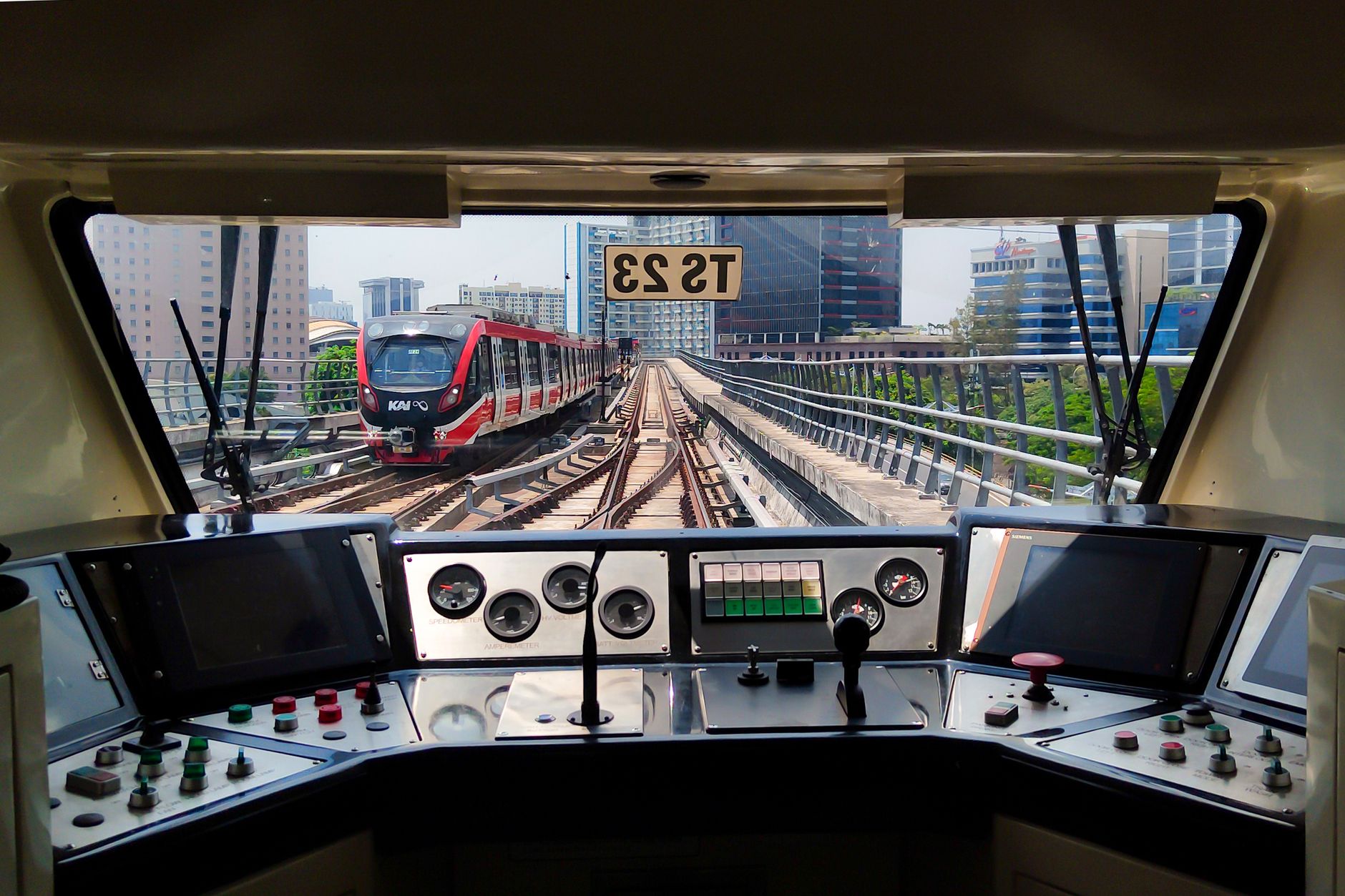 Operators monitor an urban rail network from a metro control room.