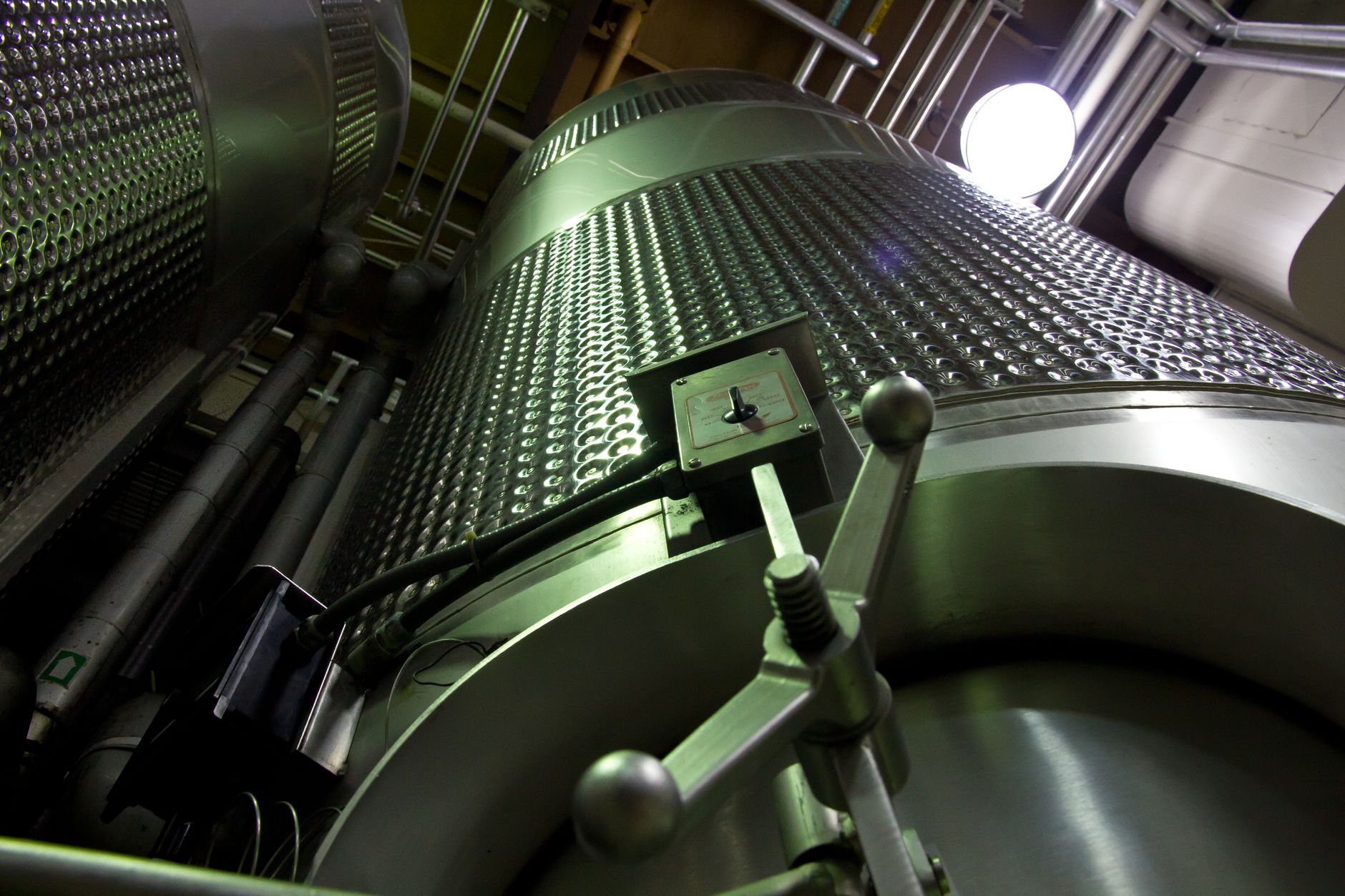The curved interior walls of a bulk bin where liner thickness must be mapped.