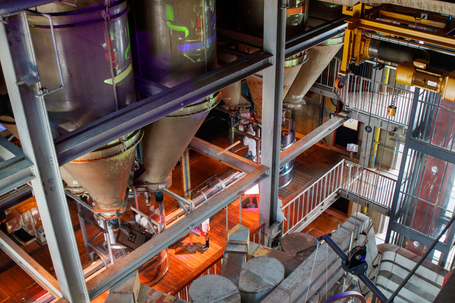 The tall enclosed bin interior where rope teams once worked at height during liner inspections.