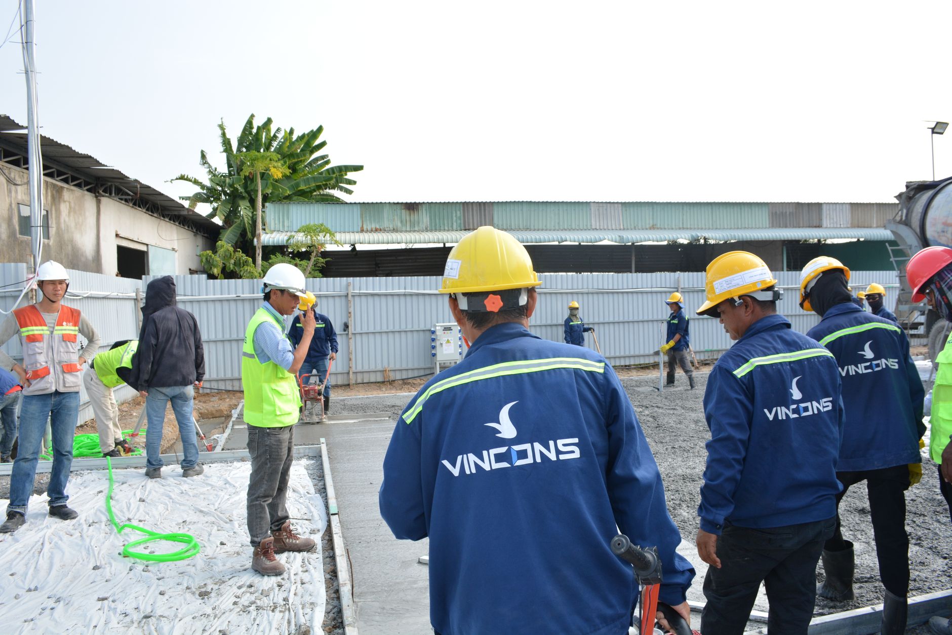 Production staff coordinating tasks after automation freed roles for higher-value work.