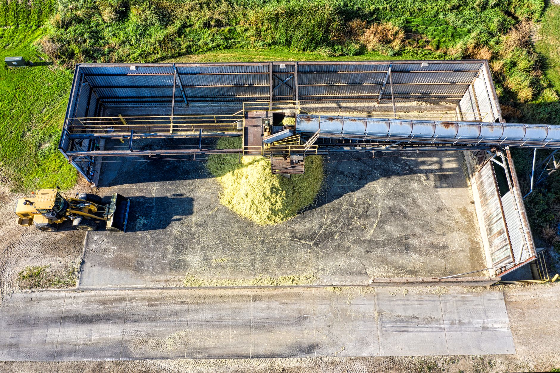 Packages move through an industrial conveyor loading station.