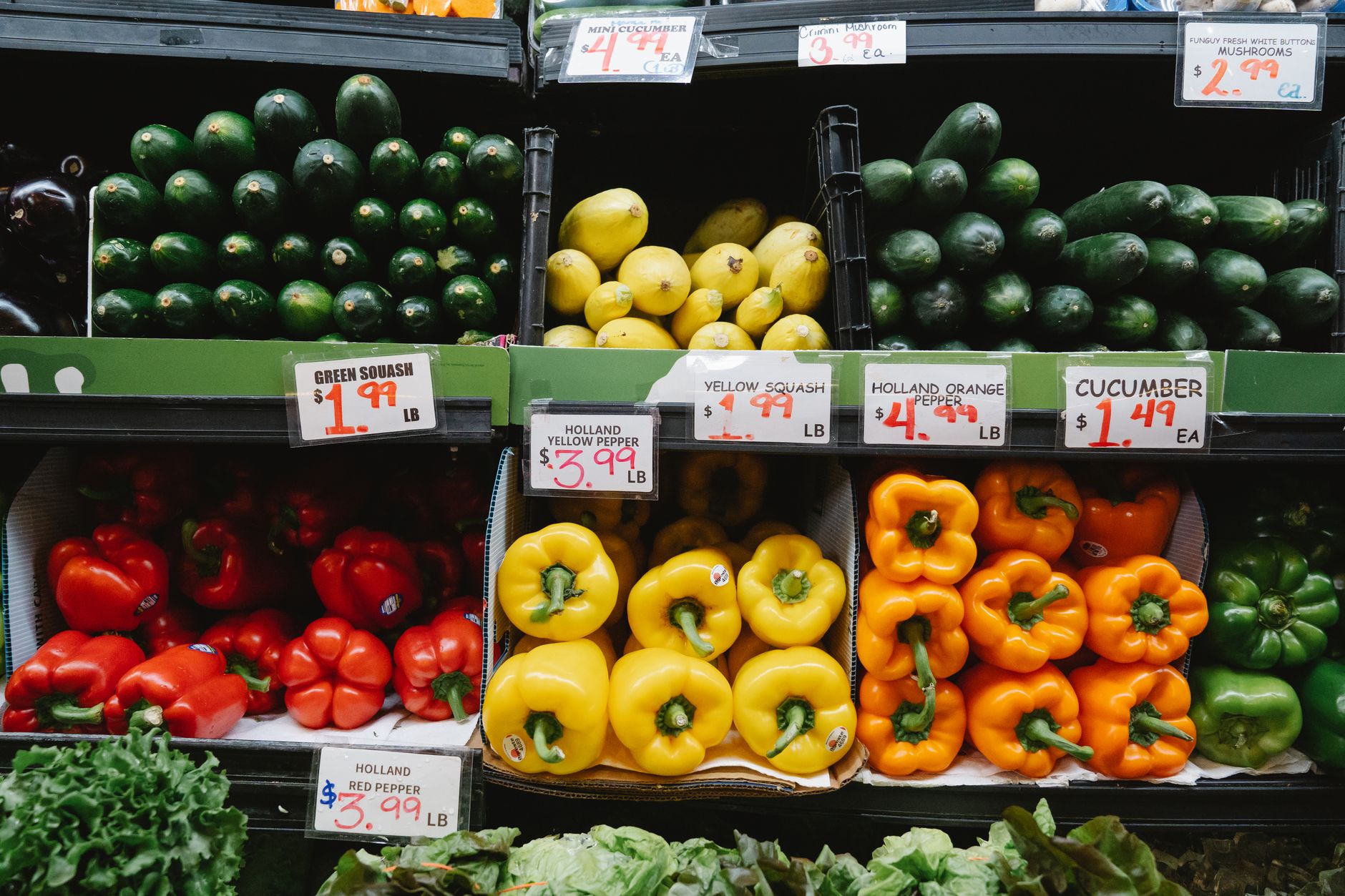 Fresh produce displays in a busy grocery store, showing the kind of shelf conditions and in-stock presentation the pilot aimed to improve.
