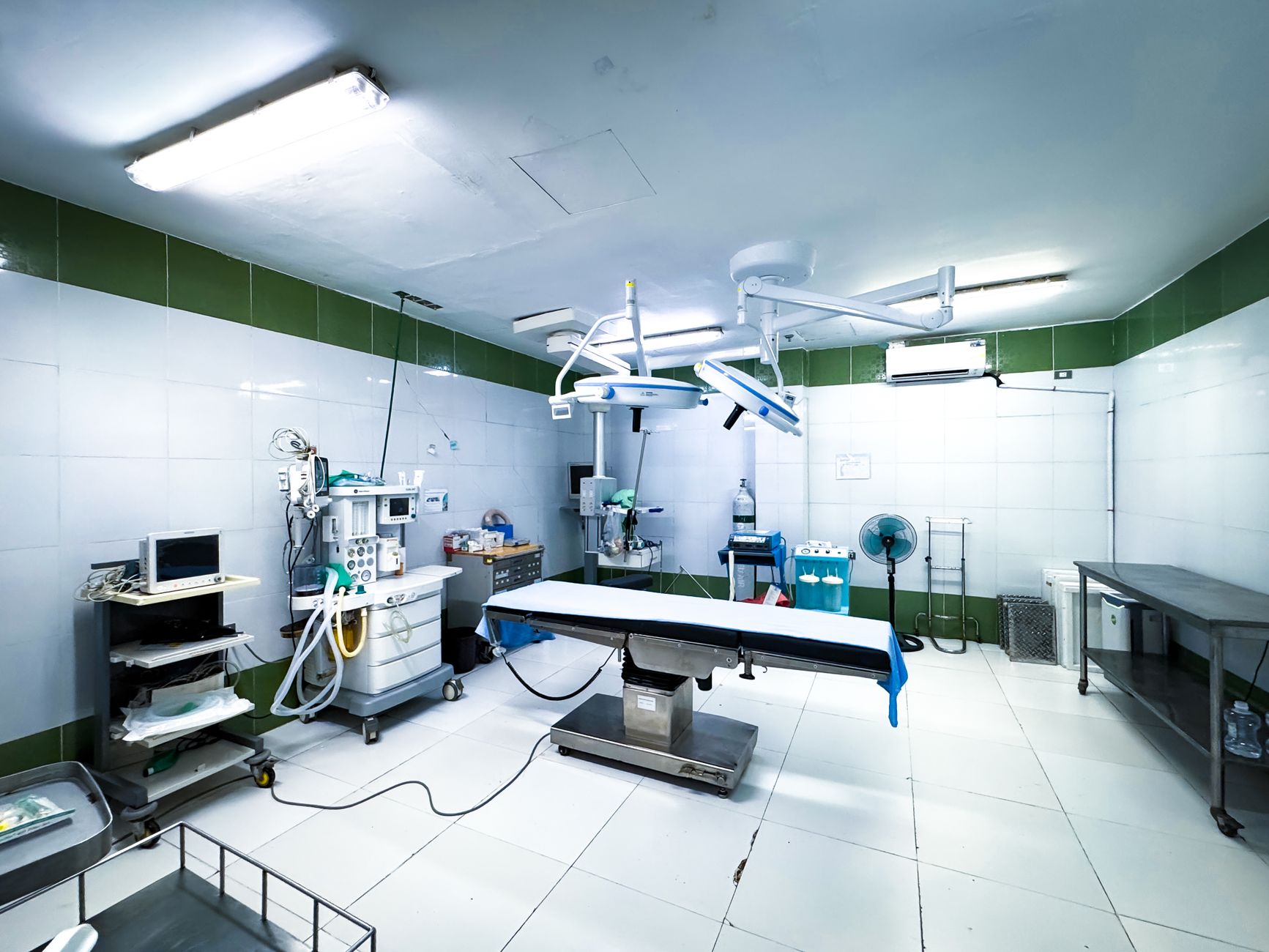 A hospital surgical corridor where sterile supplies move toward operating suites.