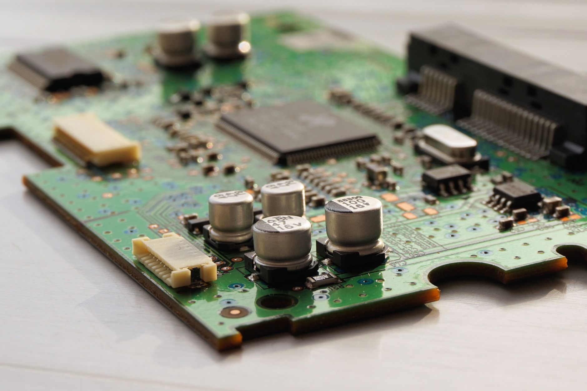 Printed circuit boards prepared for overmolding in an electronics manufacturing environment.