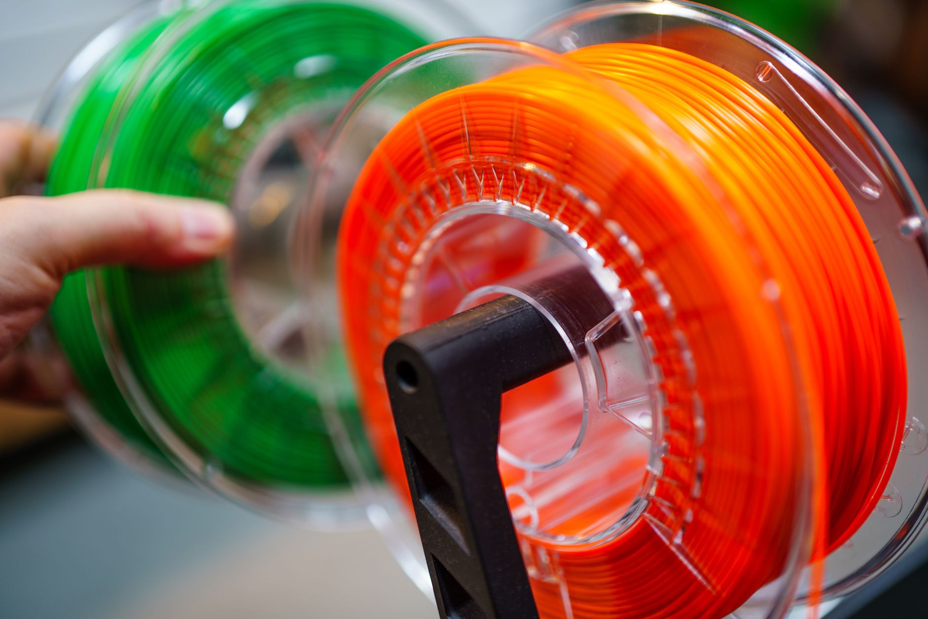 Industrial plastic spools like those assembled and welded in the automated cell.