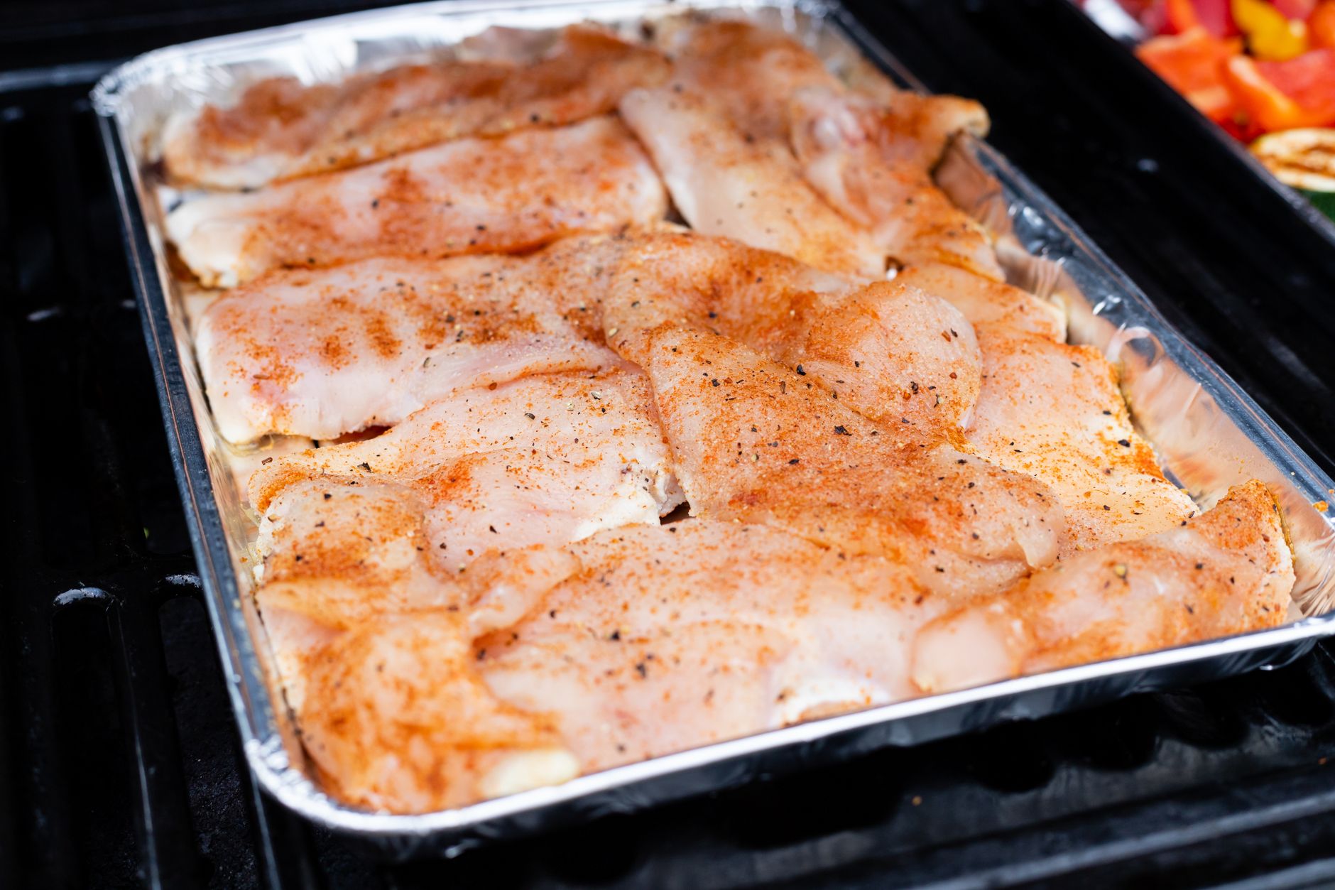 Chicken thighs like those processed on an automated deboning line.