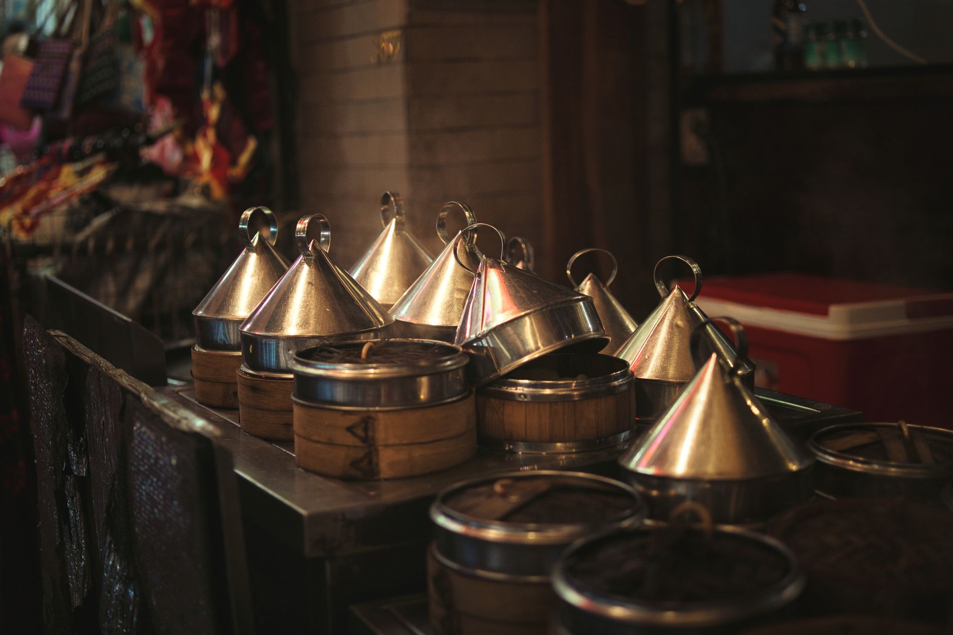 Refrigerated Indian meal trays like those portioned on an automated depositing line.