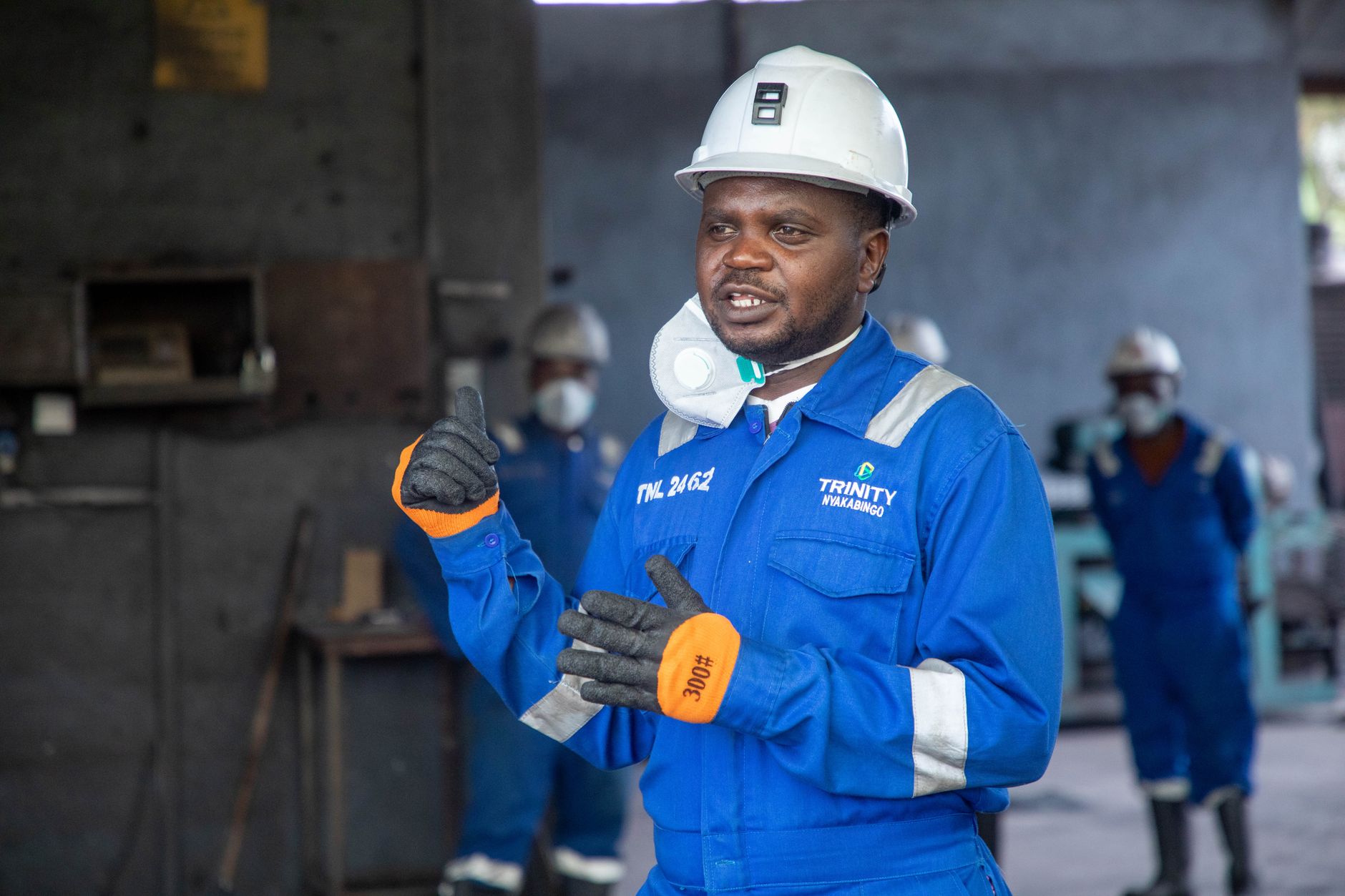 Manufacturing personnel review operating and safety procedures together on the factory floor.