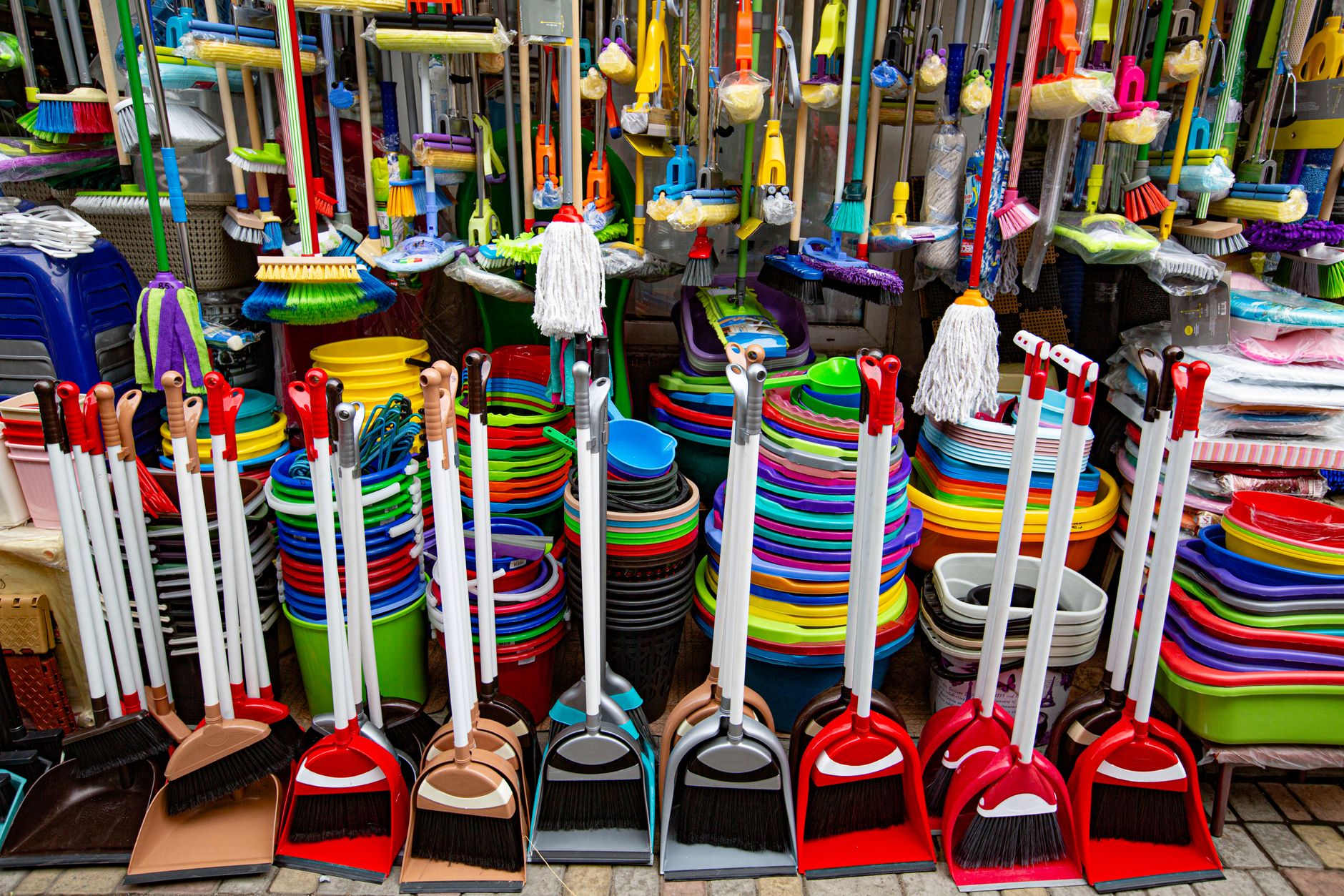 A mop and bucket setup represents the repetitive floor work associates can hand off to autonomous scrubbers.