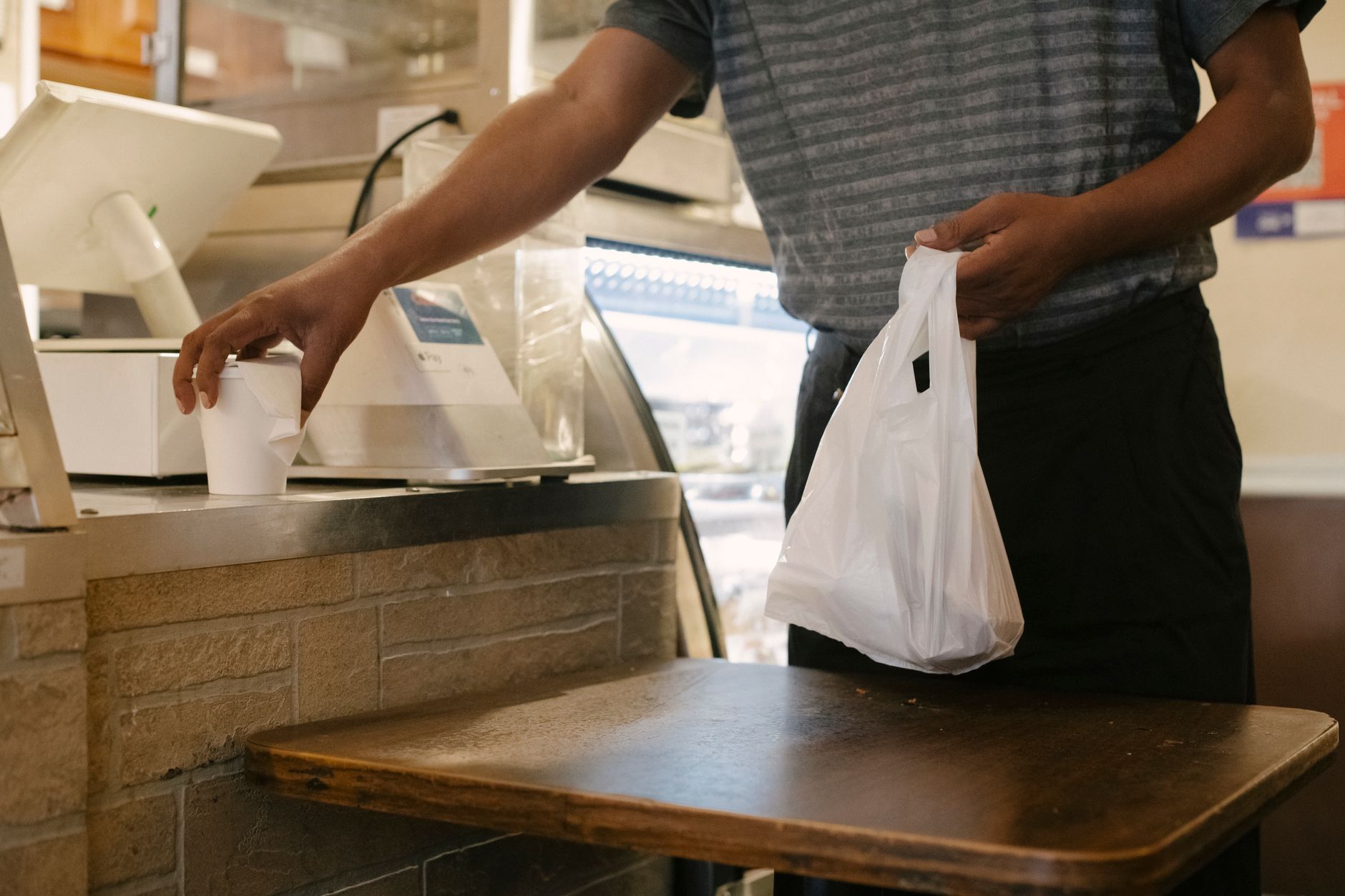A checkout counter scene reflects the guest time leadership wanted to protect when scrubbers took over aisles.