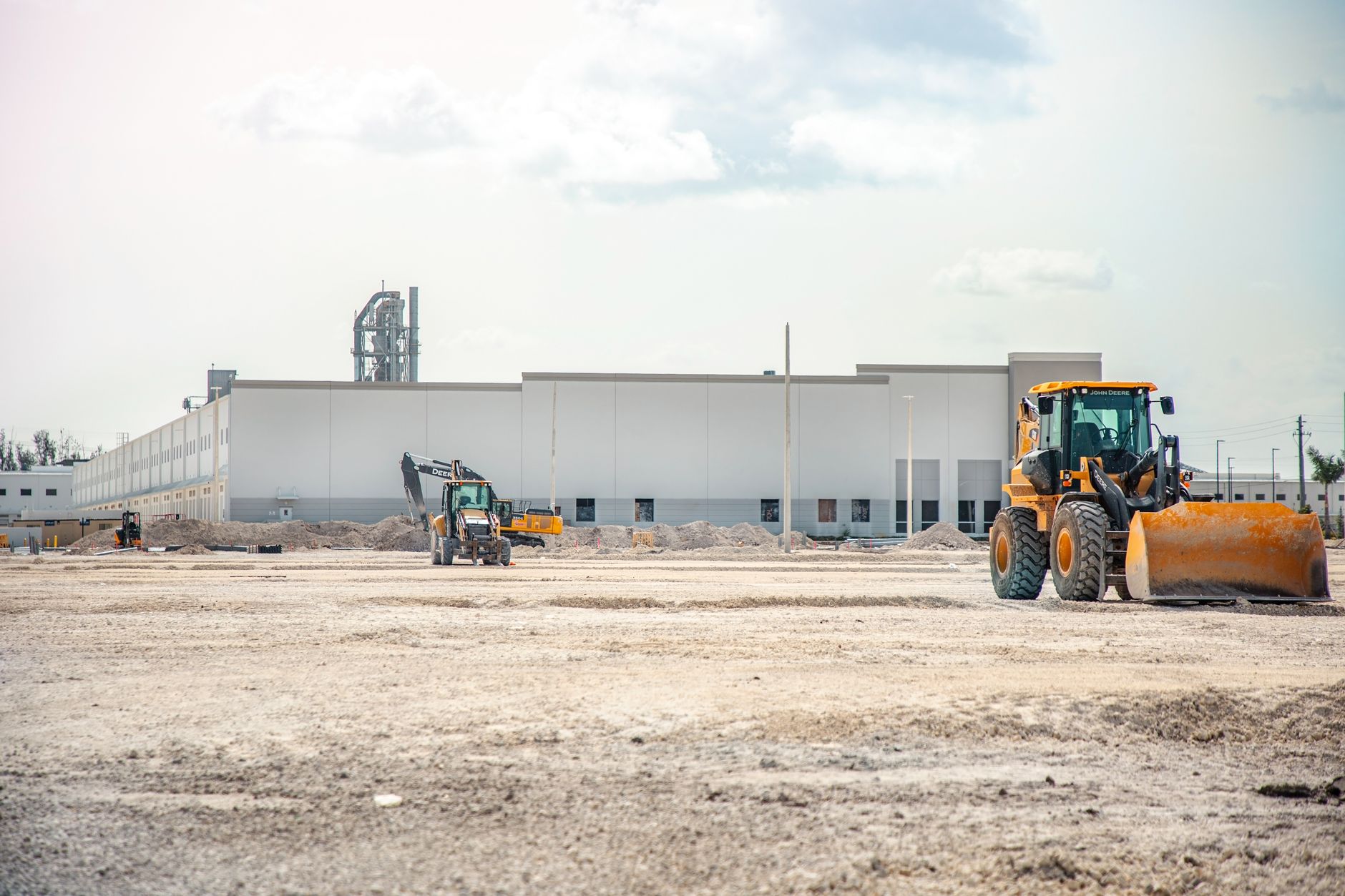 A distribution center under construction where slab layout tolerance drives automation tie ins.