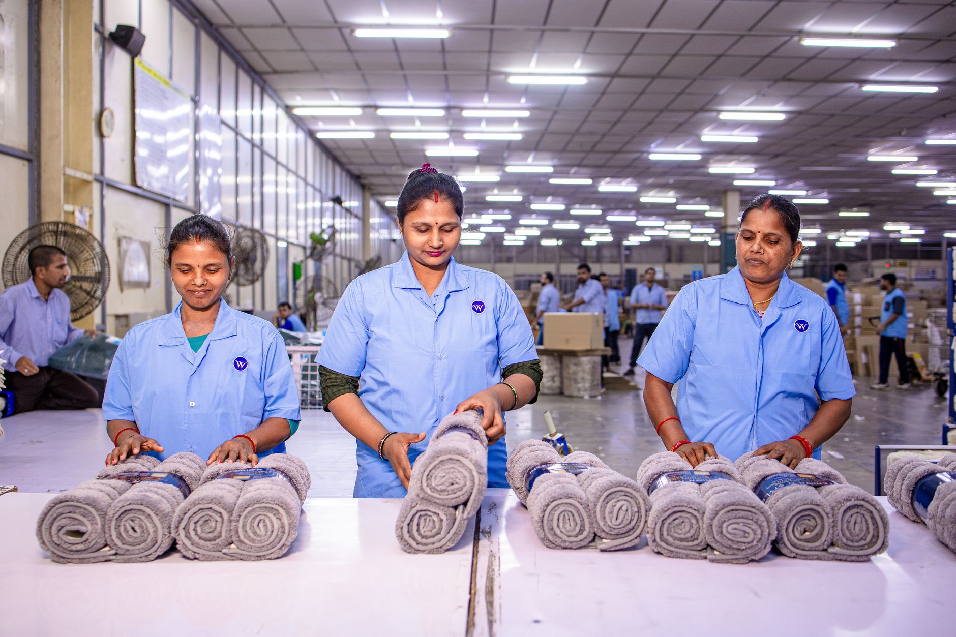 Manufacturing personnel inspecting conditions on a food production floor.