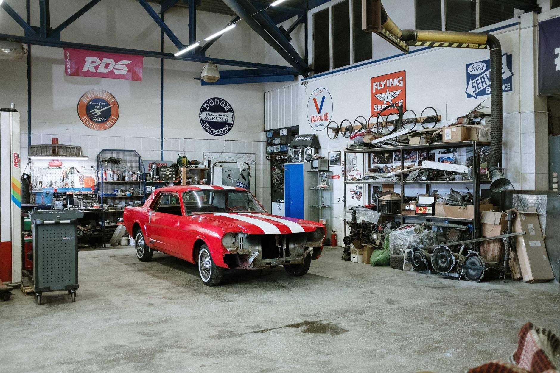 Organized automotive parts await delivery from the parts department to dealership service bays.