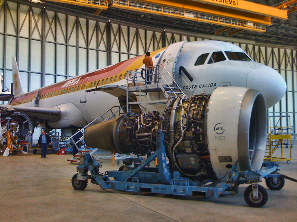 Aircraft staged on an airport apron after maintenance activity.