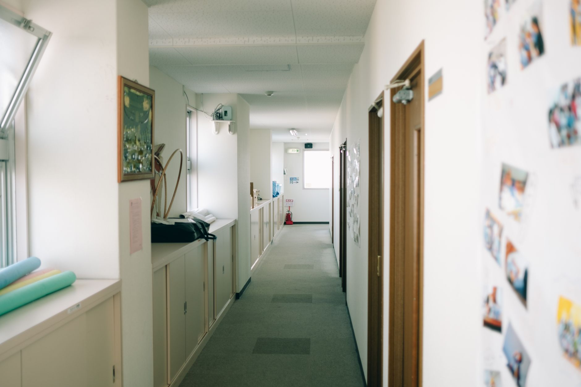 Carpeted corridors in a middle school that require nightly vacuuming.