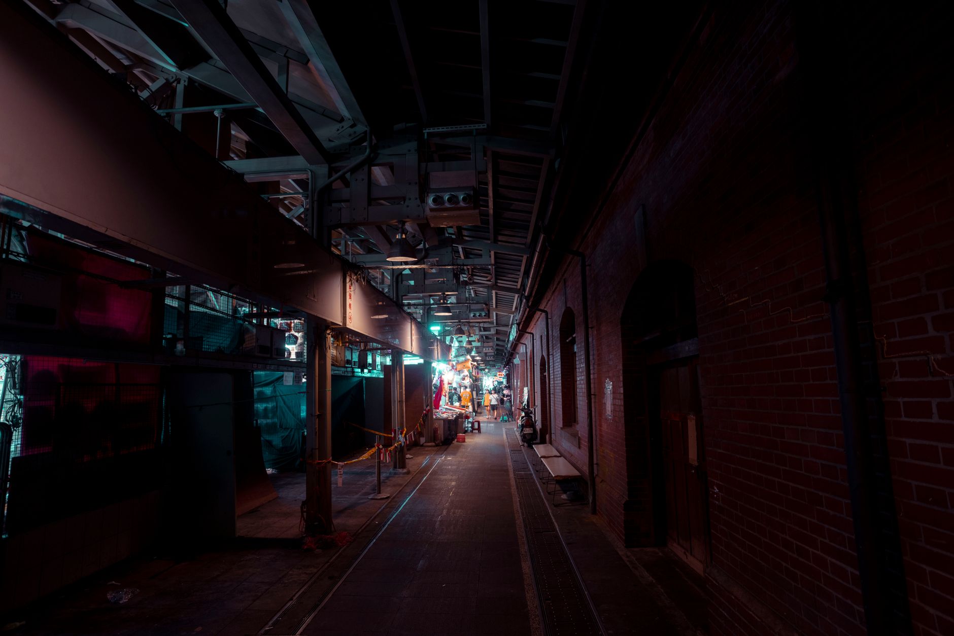 A quiet industrial hallway suited to overnight floor care when production traffic is low.