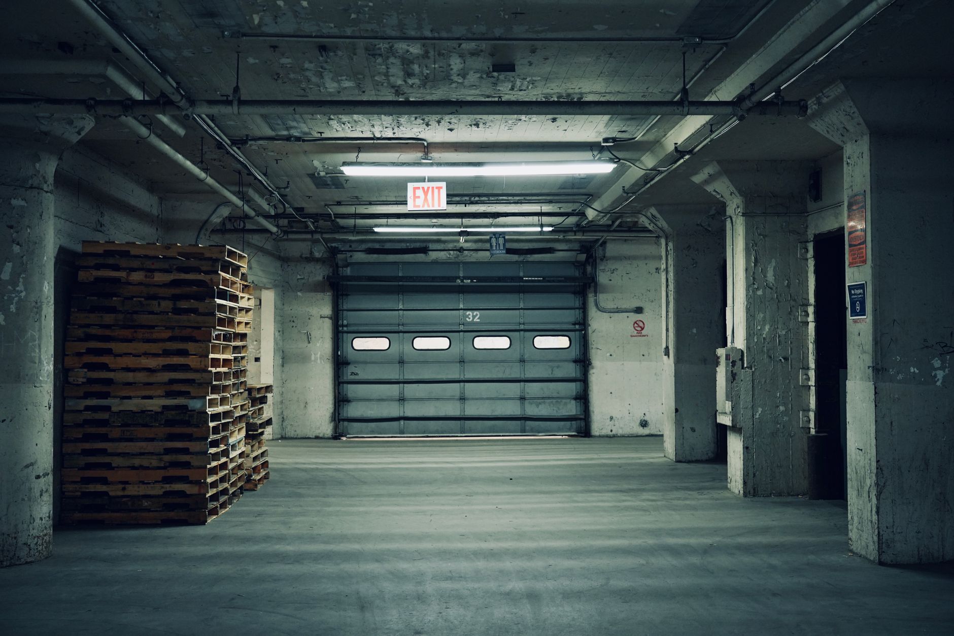 Warehouse loading bay with an open dock door and raised plate