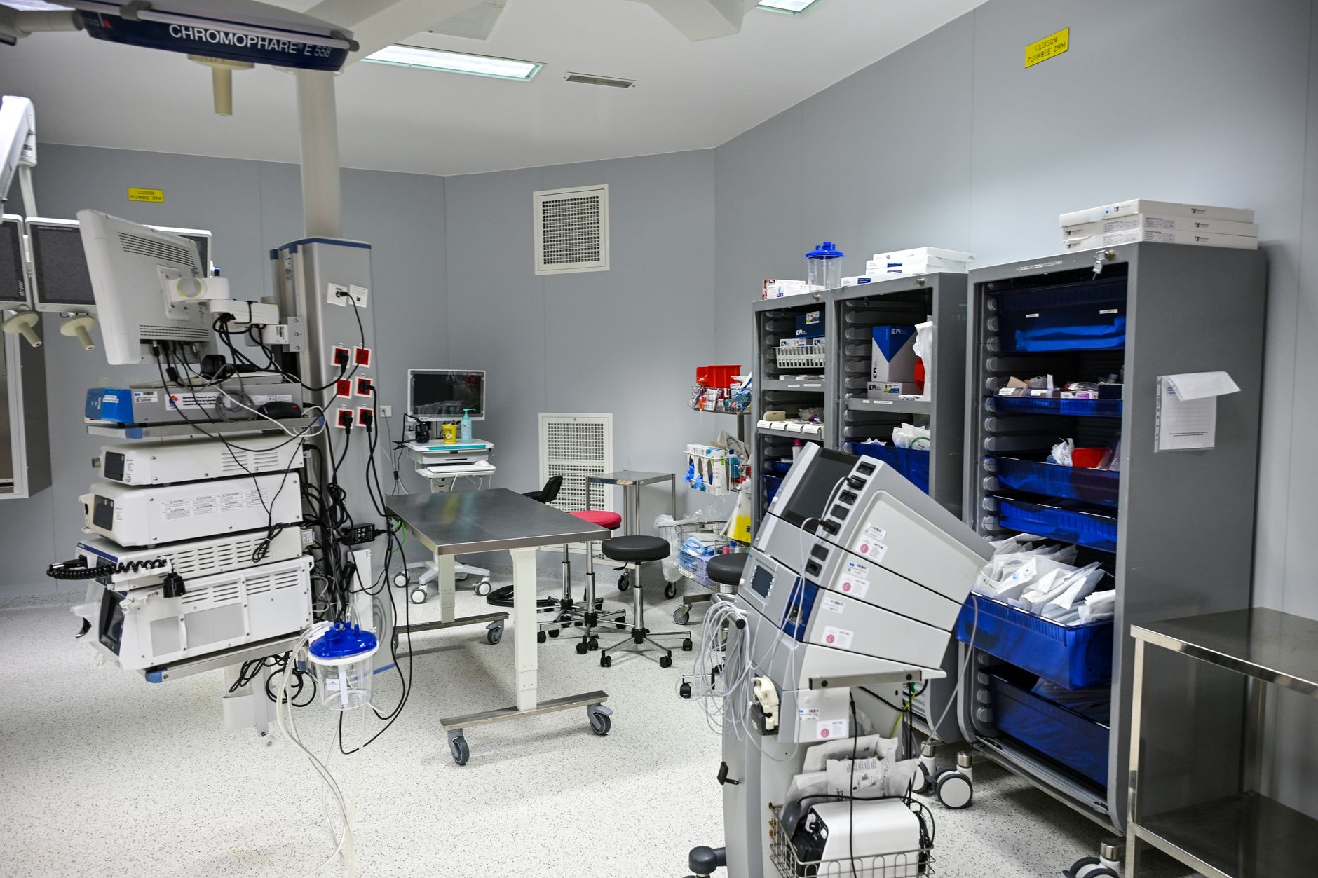 Shelves of medical supplies stacked in a hospital storage room.
