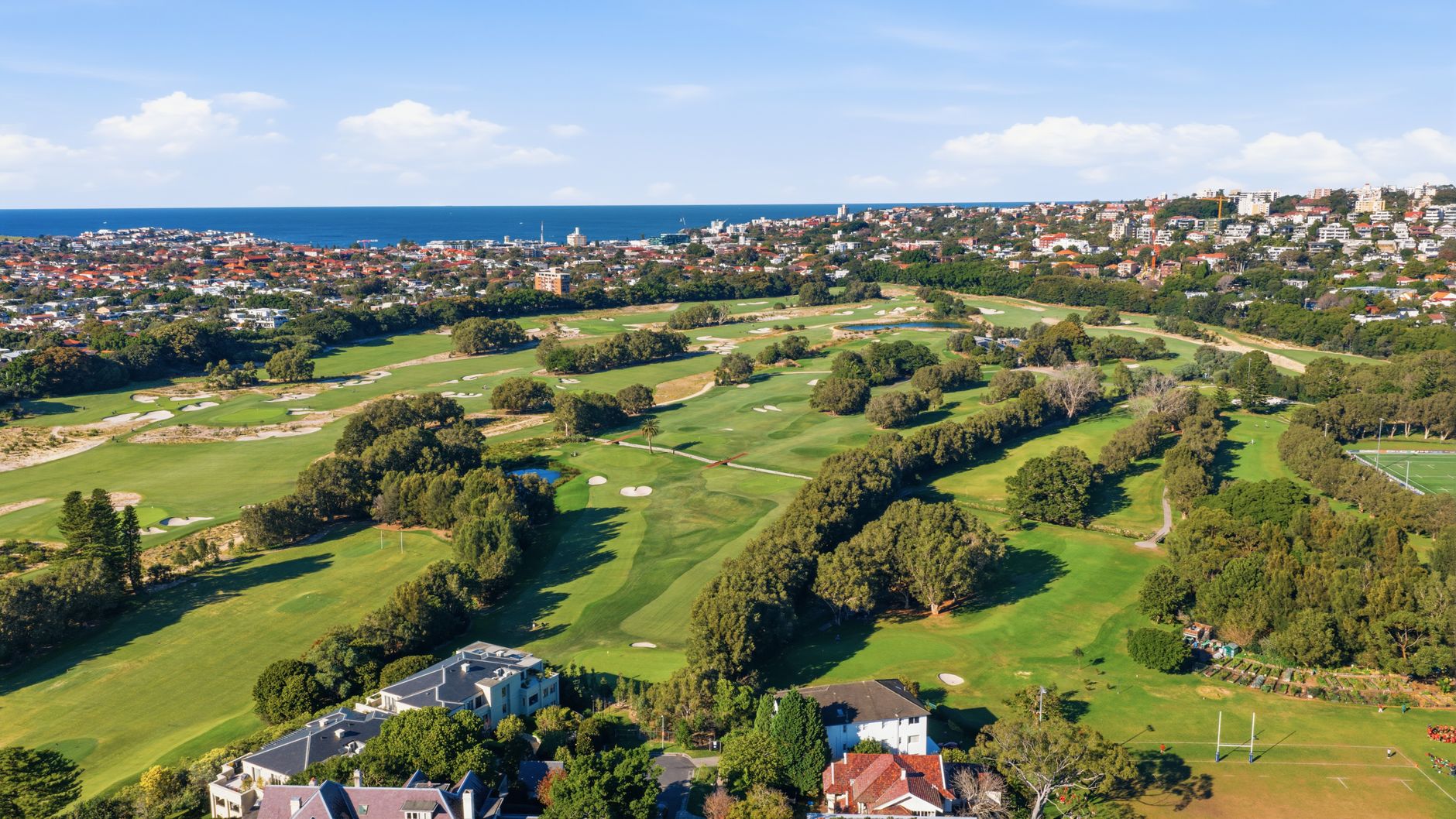 Tree-lined rough on a large suburban private golf course