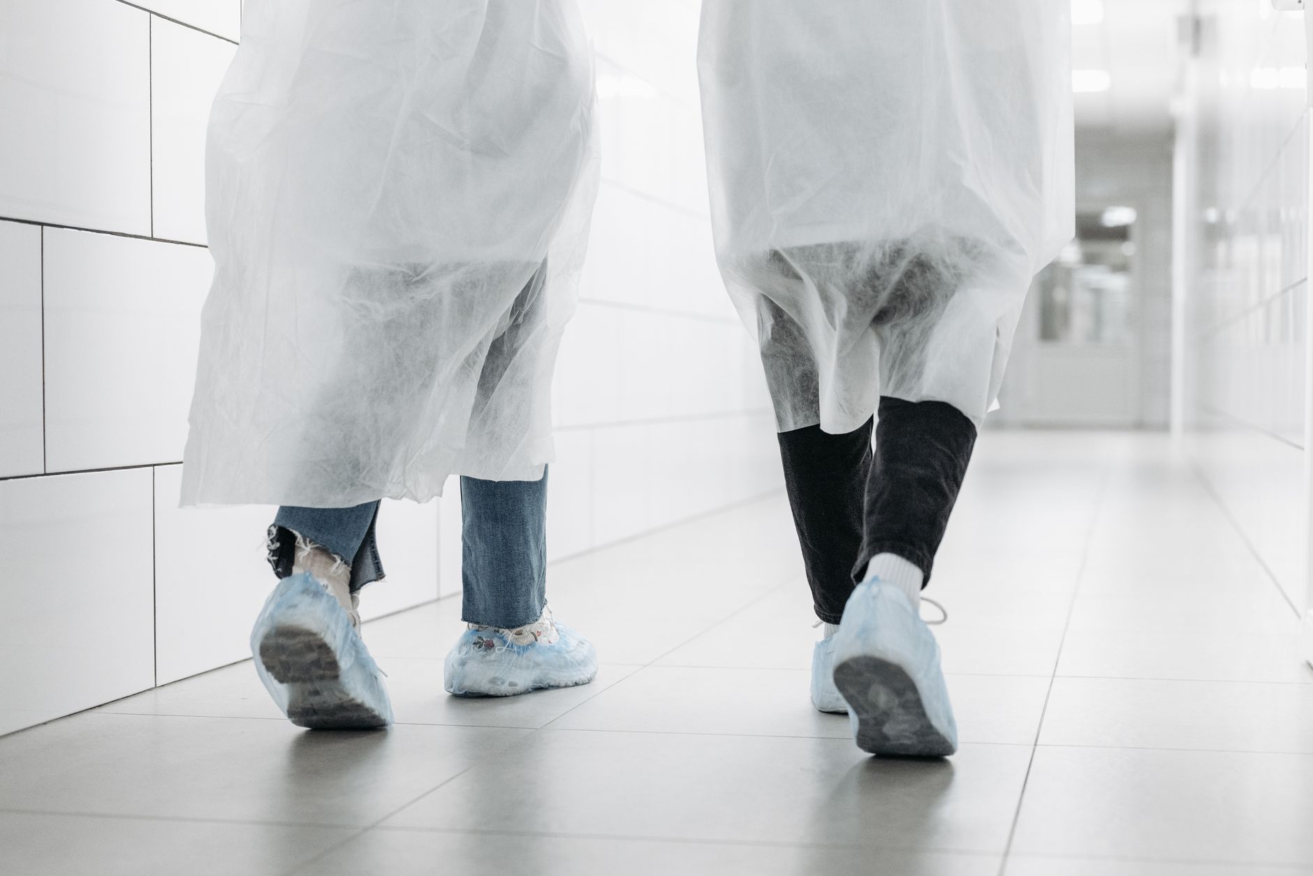 Long, brightly lit cleanroom corridor inside a U.S. semiconductor plant where materials travel between storage and production areas.