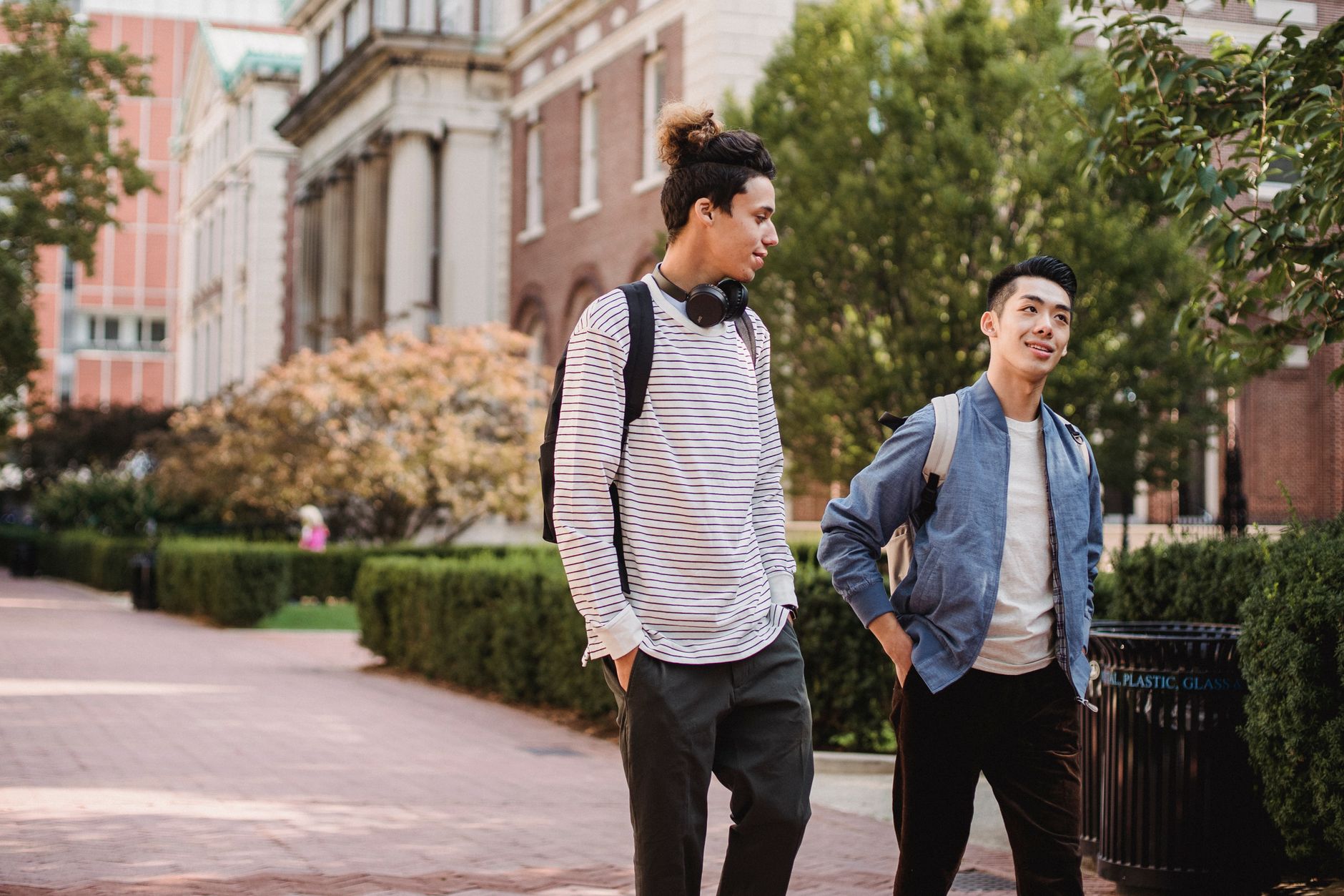 Students crossing a campus walkway underscore why facilities leaders measure cleaning robots in hours returned across millions of square feet.